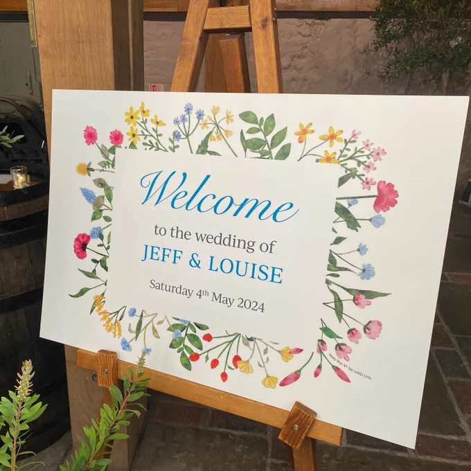 Welcome Wedding Board displayed on wooden easel