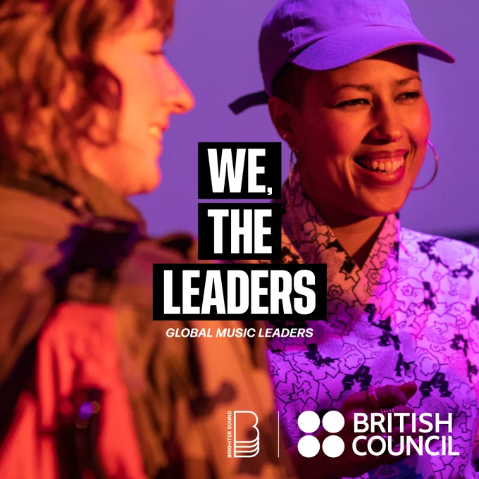Two people, one wearing a cap behind the text 'We, The Leaders'.