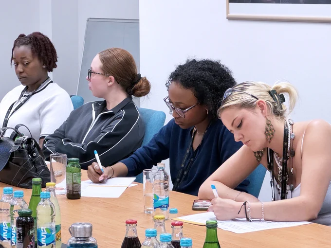 4 girls taking notes from the meeting 
