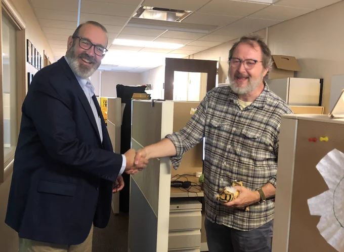 Vice Chancellor for Extension and Engagement, Chad Higgins, presents Michael Salmons with his Truman award. 