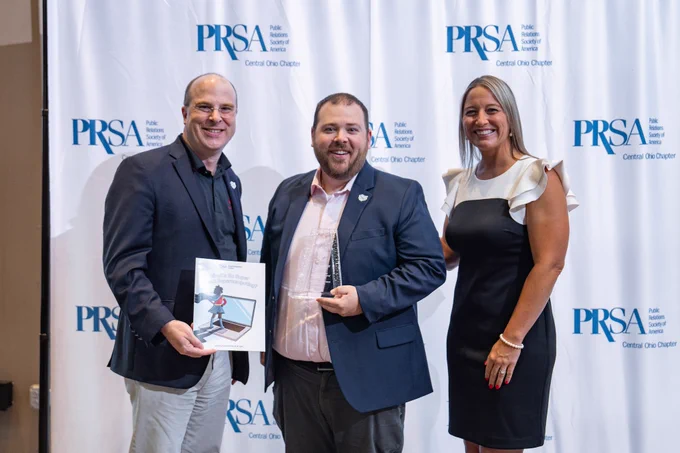 Alisa Agozzino, PRSA Central Ohio chapter president, with Alan Chalker and John Strawn of the Ohio Supercomputer Center and Ohio Technology Consortium at the PRism Awards ceremony May 23. 