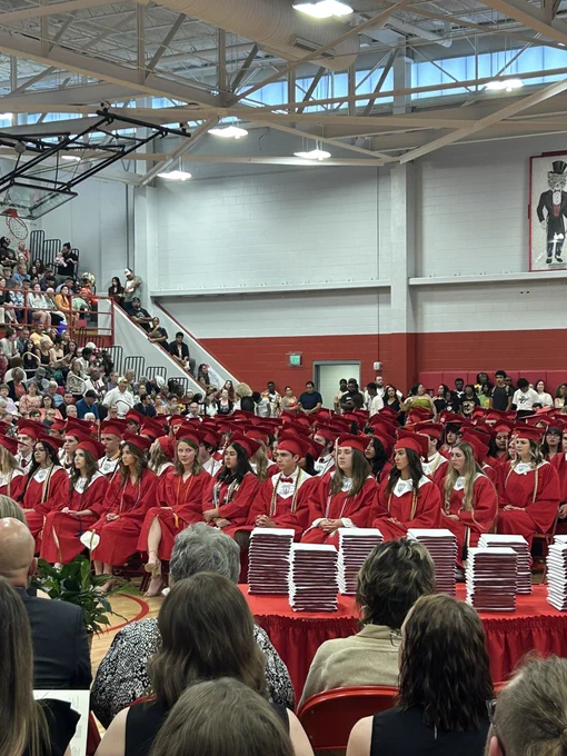 All of the graduates sitting down facing the stage.