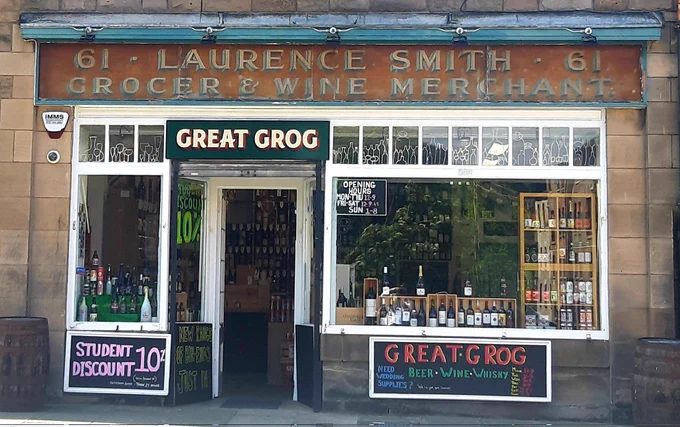 Old painted sign above a shop