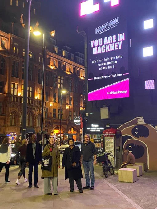 Large billboard stating YOU ARE IN HACKNEY We don’t tolerate hate, harassment or abuse here #DontCrossTheLine