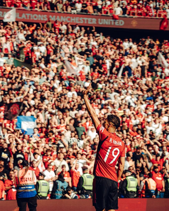 Raphael Varane waves to the United fans at Wembley.