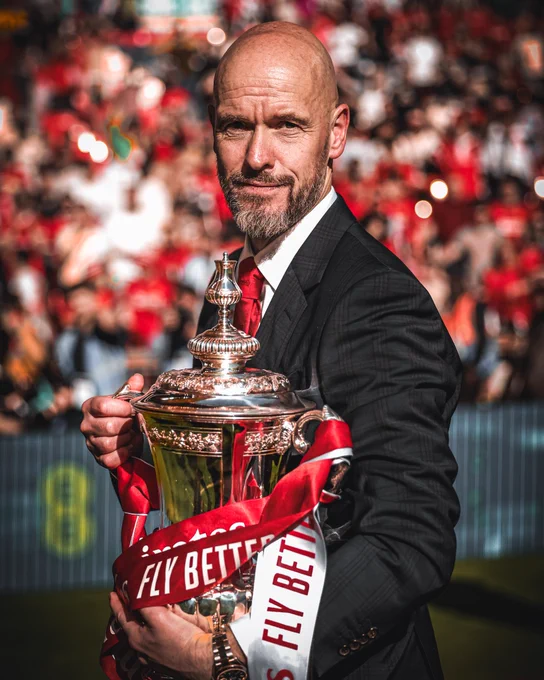 An image of Erik ten Hag with the Emirates FA Cup trophy