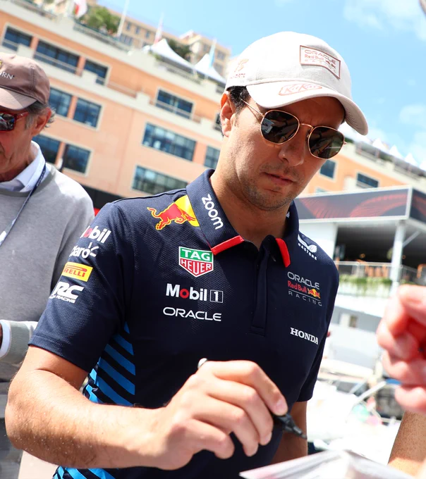 Checo Perez signs autographs at the Monaco GP.