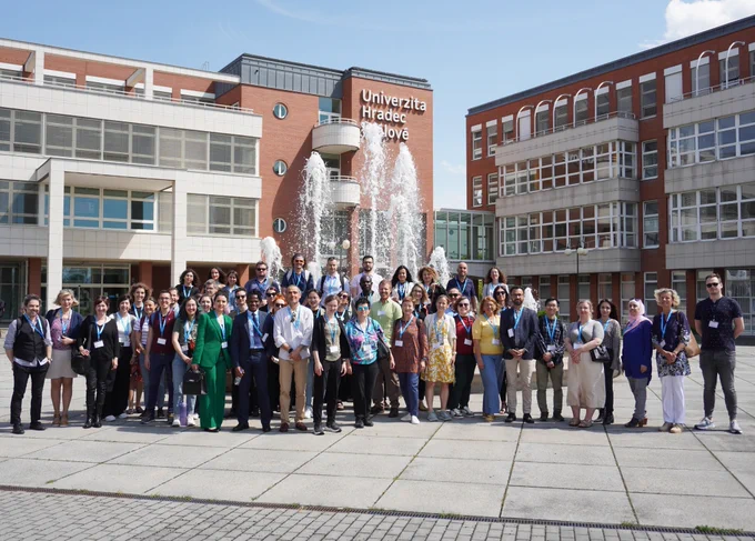 A group photo of the LITHME training school attendees in front of the University of Hradec Králové building.