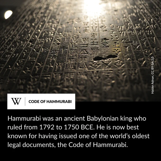 Close up of the Code of Hammurabi etched with cuneiform script, illuminated by soft light that highlights the intricate detail of the wedge-shaped characters. Text says: Hammurabi was an ancient Babylonian king who ruled from 1792 to 1750 BCE. He is now best known for having issued one of the world’s oldest legal documents, the Code of Hammurabi.