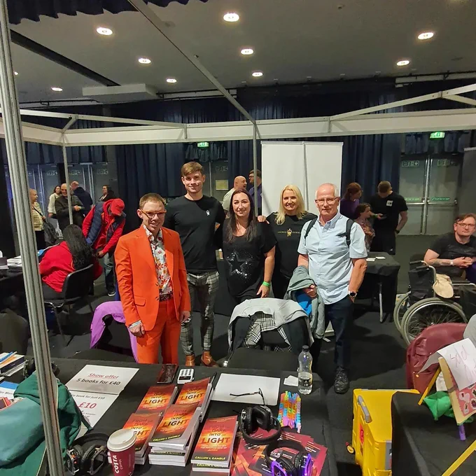Group photo at the Autism Meets stand with Alex Manners, Callum Launus-Gamble, Jen, Caren & Brian Bird.
