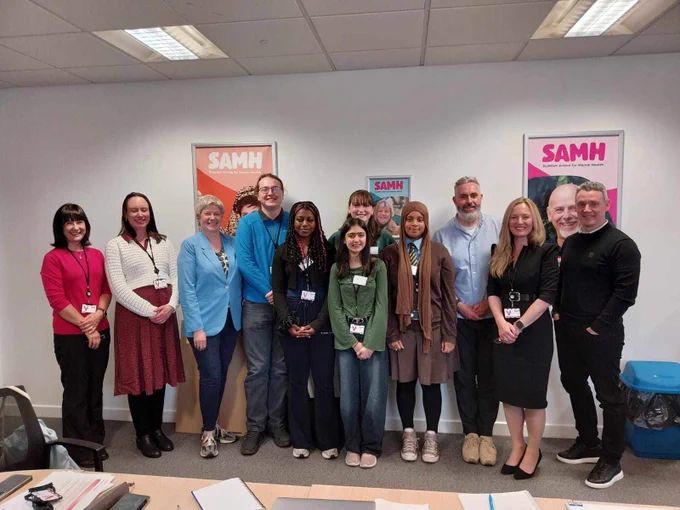 Members of our board pose alongside our young campaigners.