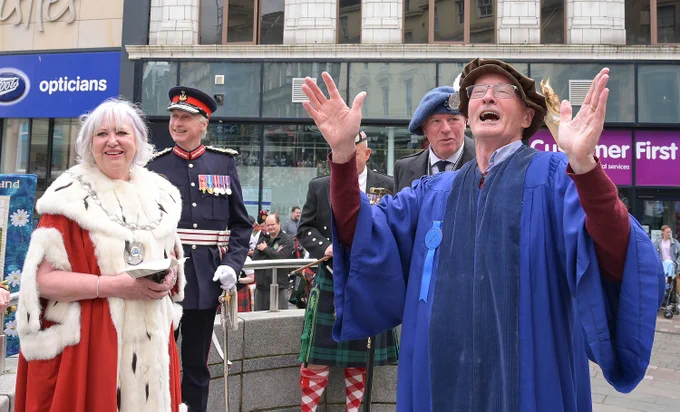Bellman David Smith addresses the crowds ahead of the procession
