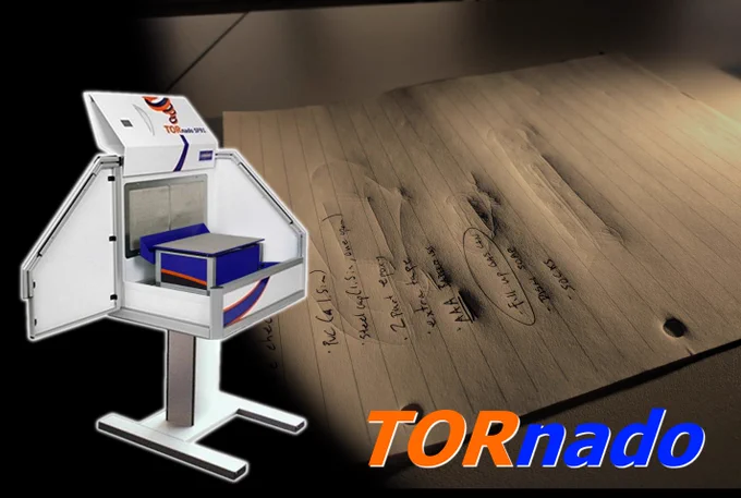 A photo of a TORnado workstation with an electrostatic detection device overlays a piece of paper with visible handwriting and faint indented writing.
Text at the bottom of the image says: TORnado

