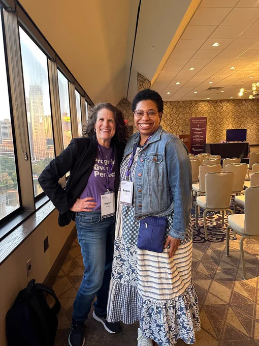 Me with Regine Gilbert in a reception space next to a window