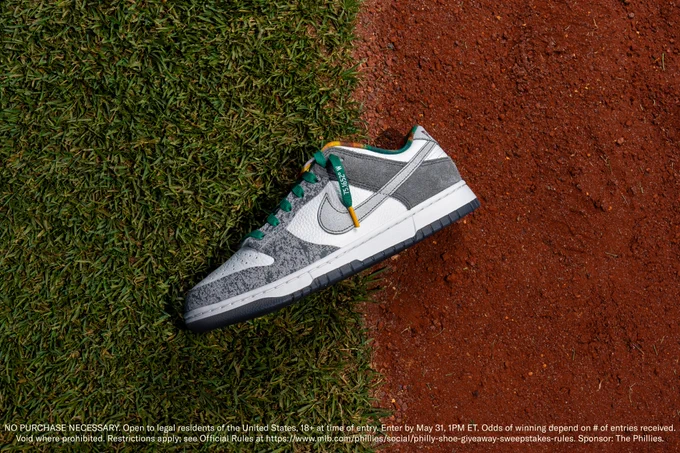 Image of 'Philly' Dunk shoe on grass and infield dirt. 

Abbreviated rules: NO PURCHASE NECESSARY. Open to legal residents of the United States, 18  at time of entry. Enter by May 31, 1PM ET. Odds of winning depend on # of entries received. Void where prohibited. Restrictions apply; see Official Rules at  https://www.mlb.com/phillies/social/philly-shoe-giveaway-sweepstakes-rules. Sponsor: The Phillies.