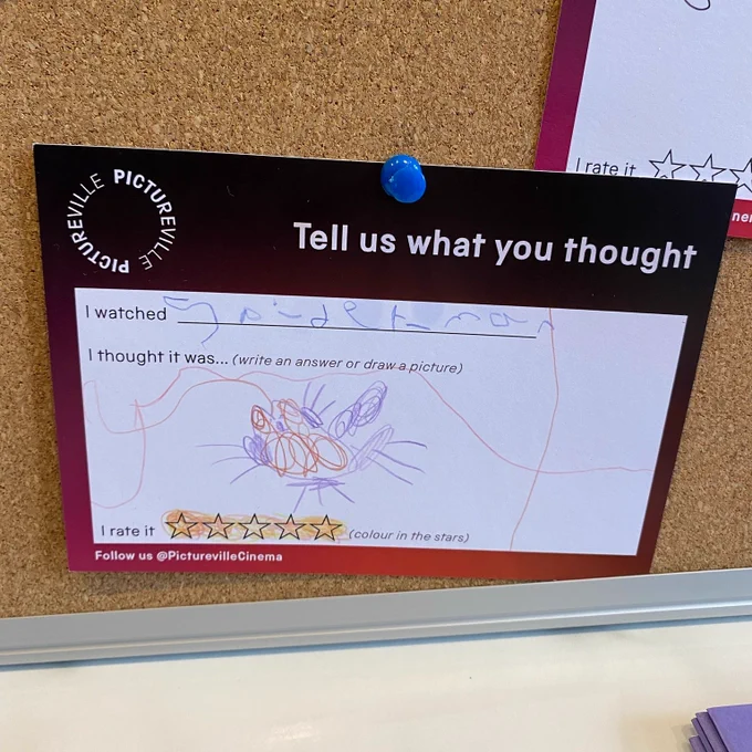 A comment card saying 
'I watched Spiderman
With a colourful doodle of a spider and five stars'