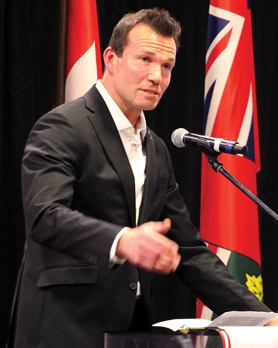 Luke Richardson gives a speech at the podium from his induction into the Ottawa Sports Hall of Fame