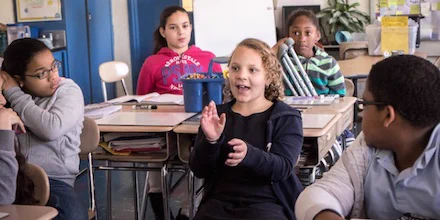 Active students learning in class. When teachers create a welcoming, safe, inclusive learning space, student brains activate. They are calm & ready to learn, says UDL expert Elizabeth Stein.