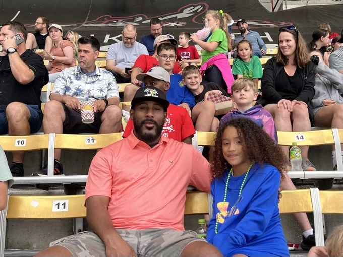 Families watching a baseball game