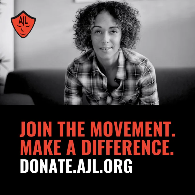 A woman with curly hair and a plaid shirt looks inquisitively into the camera, the picture is in a black and white filter. A red AJL mask logo is in the upper lefthand corner. Underneath the woman, there is red text reading “JOIN THE MOVEMENT. MAKE A DIFFERENCE. DONATE.AJL.ORG”
