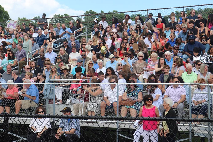 attendees in bleachers