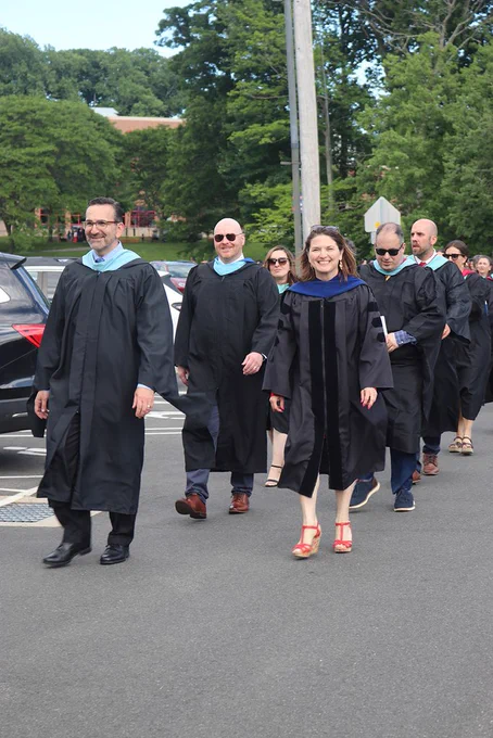 administrators lead graduates