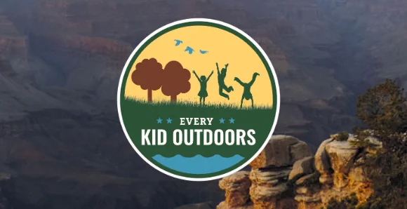 Graphic that reads "Every Kid Outdoors" on top of a picture of mountainous desert. 