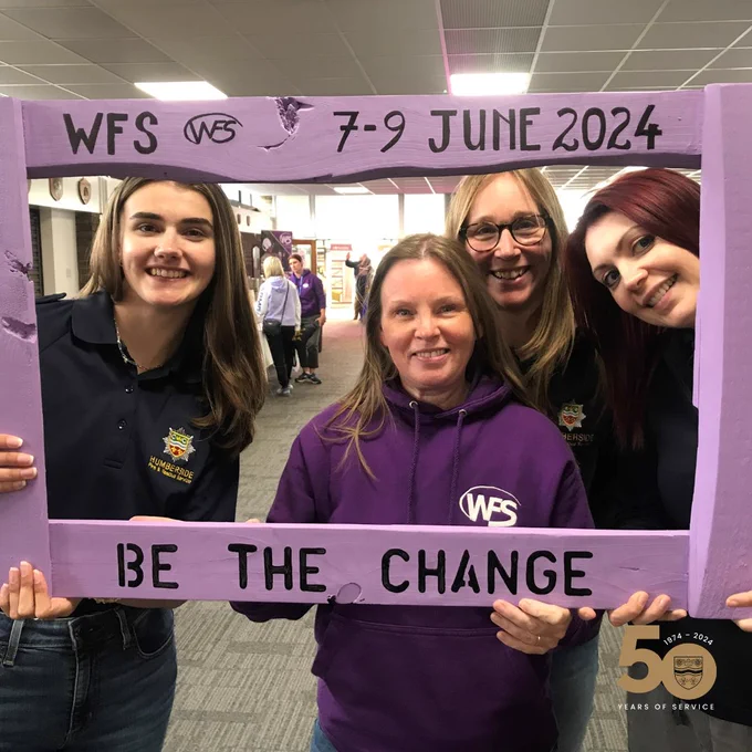 HFRS staff holding a WFS sign  