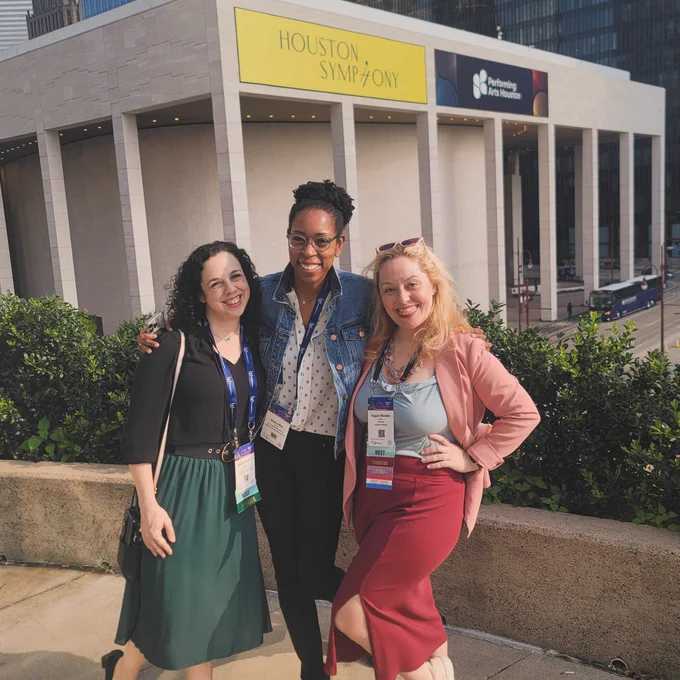 Ragan, Allison and Shana posing as a group and smiling at the camera at the League of American Orchestras National Conference.