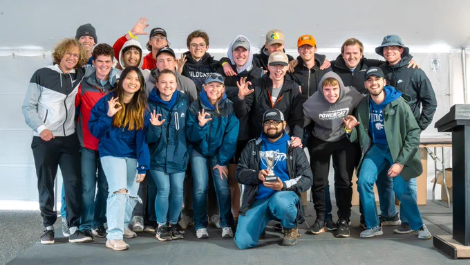 The team poses with its trophy.