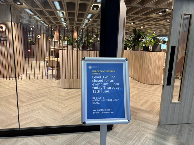 A sign outside an entrance advising people that the space will be closed on a particular date