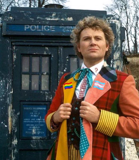 Sixth Doctor, wearing a trans and pride flag as pins.