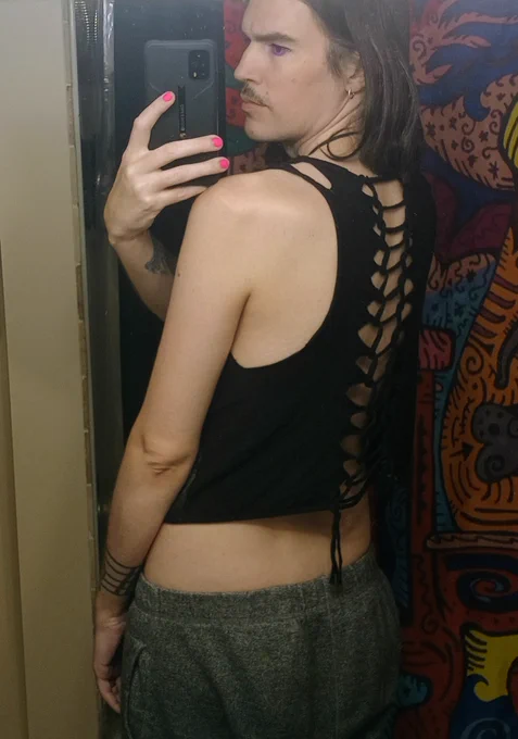 side/back profile, showing the large arm holes and the loops down the back 