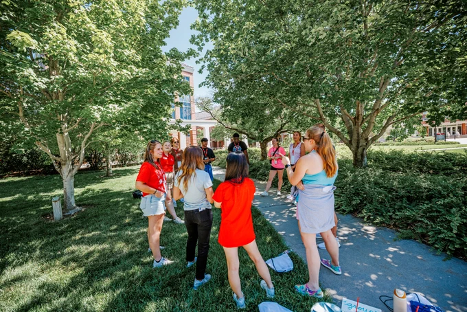 Makayla Larntz has her group in the shade as they play an ice-breaker game.