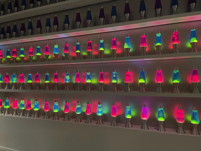 Several rows of different colour lava lamps in the Cloudflare offices 
