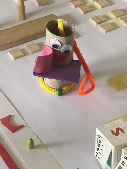 A toilet roll holder built as a robot with googly eyes