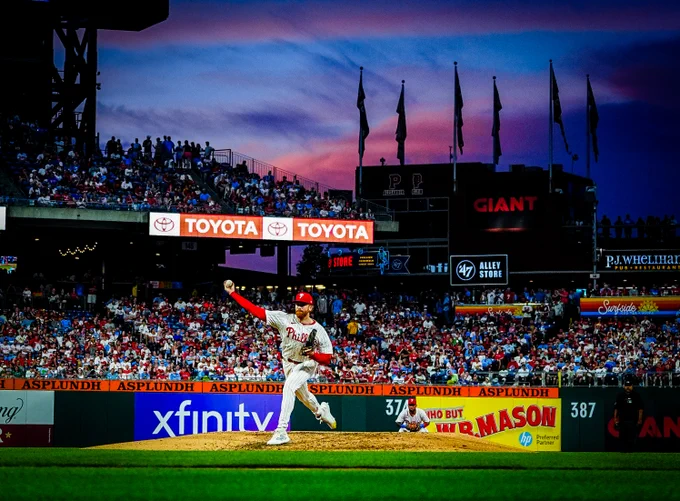 Spencer Turnbull throws a pitch on the mound at Citizens Bank Park. Behind him, the sky is a mix of shades of blue and purple.