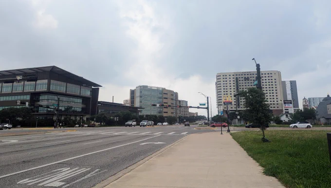 Street view of College Station, TX, with Texas A&M in the background.