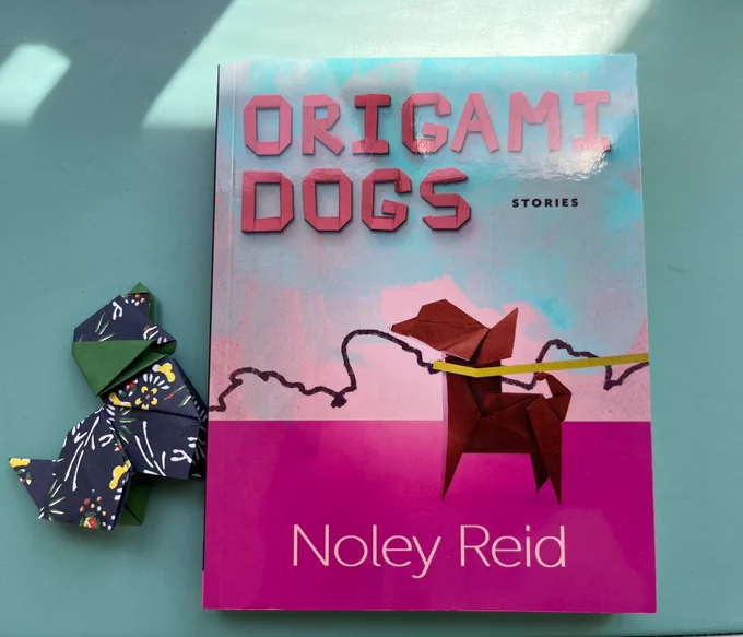 Cover of Origami Dogs by Noley Reid, with origami dog