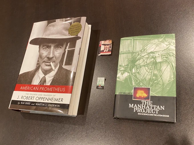 Photo of two books and their crafted miniature (Barbie size) versions: American Prometheus by Martin J. Sherwin and The Manhattan Project by Jeff Hughes.