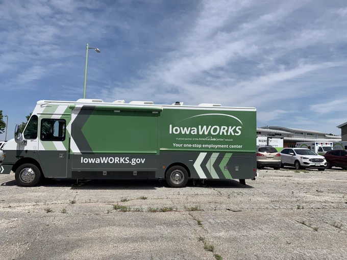 A photograph of the IowaWORSK Mobile Workforce Center on-site in Greenfield, Iowa.