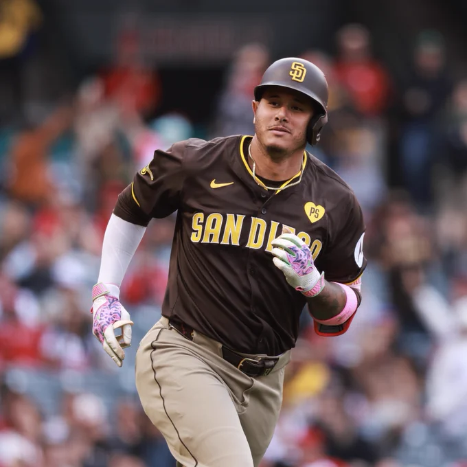 Photo of Manny Machado from today's game at Angel Stadium. He is looking towards the Padres dugout and giving a slight smirk after hitting a home run in the first inning. He is wearing the Padres brown road uniform.