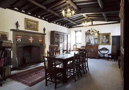 Museum of the Order of St. John Library old room with bookcases and a table with chairs