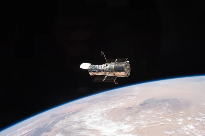 The Hubble Space Telescope in orbit above Earth.