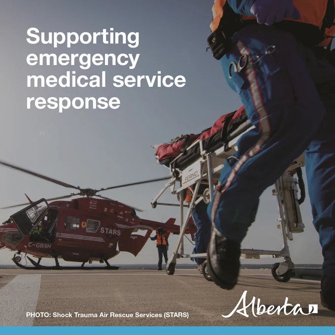 Text reads supporting emergency medical service response. Photo credit: Shock Trauma Rescue Services (STARS). A red helicopter with the white STARS logo is on a landing pad. Paramedics are running with a a gurney. The white Alberta logo is on the bottom right corner. 