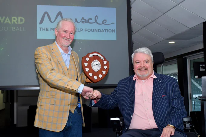 Michael McGrath MBE presenting the award to Nick Woodward, the recipient of 2024. 