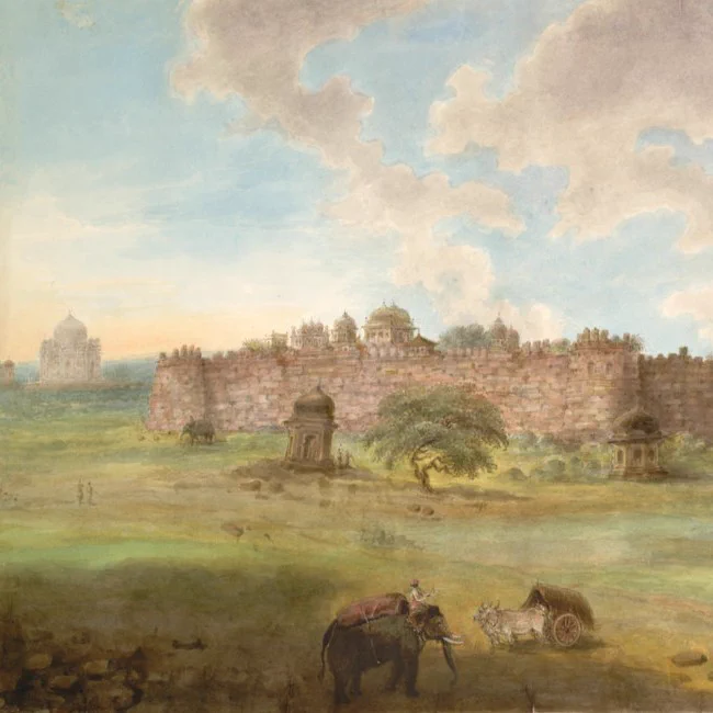 An early 19th-century print of a landscape view in India, with an old walled fort as the main focus. In the foreground, a man rides an elephant.