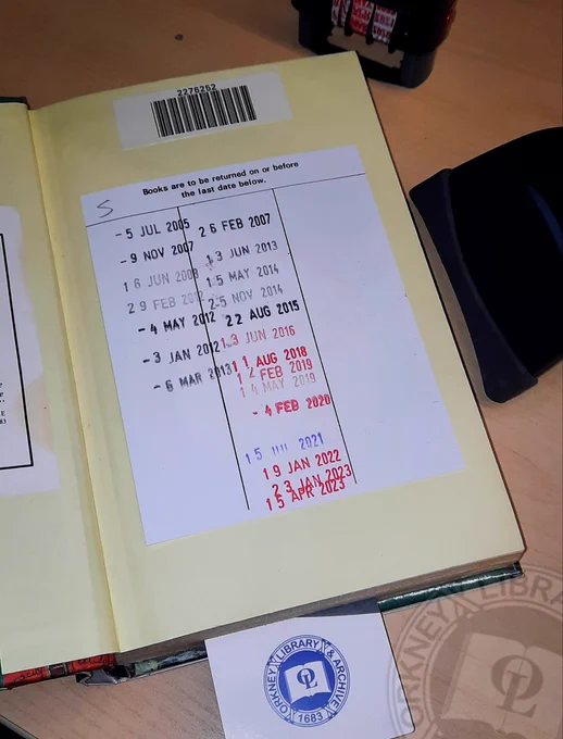 A library book date label with dates from 2005 to 2023