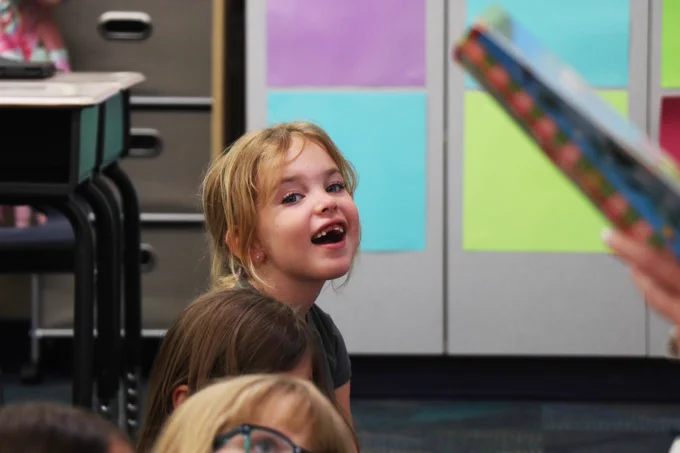 A Rockwood student smiles while participating in a math and reading game.