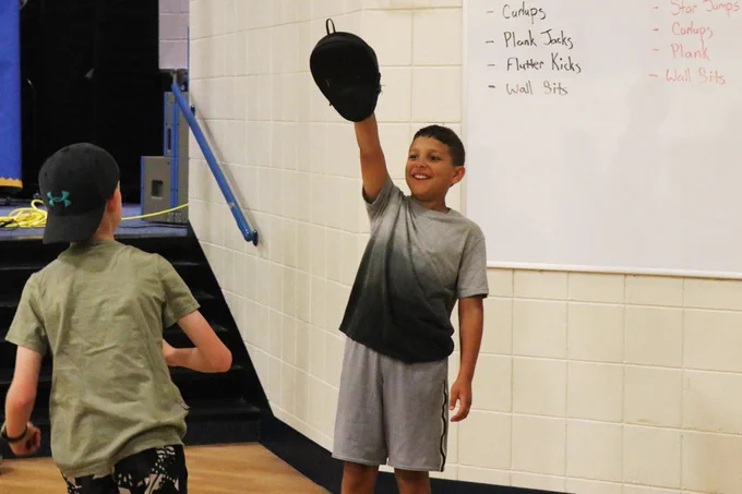 A Rockwood student smiles while participating in a martial arts demonstration.